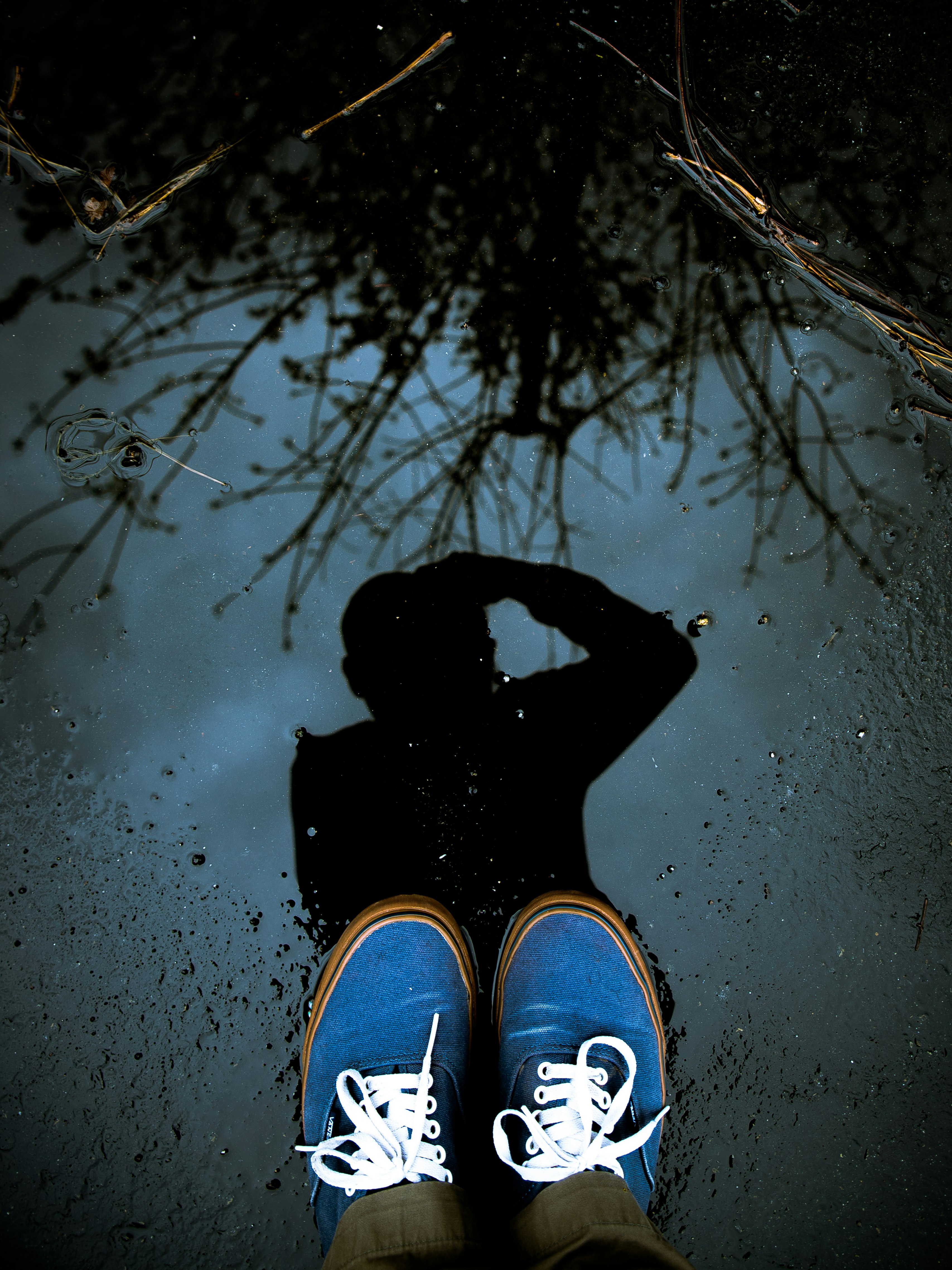 person wearing blue sneakers